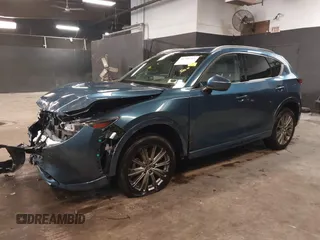 2023 Mazda CX-5 Signature with VIN JM3KFBXY4P0120187, listed as a IAAI auction lot 41706264 with 9,402 mi miles and . Bid and sale history available at carsss.com. Image 19.