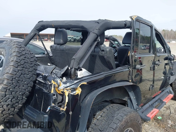 2015 Jeep Wrangler Unlimited Rubicon z VIN 1C4BJWFG7FL711036, wystawiony jako IAAI lot #41604648 z przebiegiem 167 678 mil mil oraz . Historia ofert i sprzedaży dostępna na DreamBid. Obrazek 14.