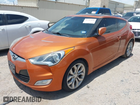 2013 Hyundai Veloster w/Black Int with VIN KMHTC6AD0DU147017, listed as a IAAI auction lot 42707858 with 115,130 mi miles and . Bid and sale history available at DreamBid. Image 2.