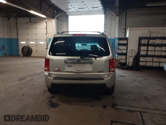 2009 Honda Pilot Touring with VIN 5FNYF48929B010331, listed as a IAAI auction lot 41965094 with 142,490 mi miles and . Bid and sale history available at carsss.com. Image 16.