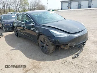 2018 Tesla Model 3 Long Range Battery z VIN 5YJ3E1EB2JF103096, wystawiony jako IAAI lot #42016324 z przebiegiem 143 247 mil mil oraz . Historia ofert i sprzedaży dostępna na DreamBid. Obrazek 1.