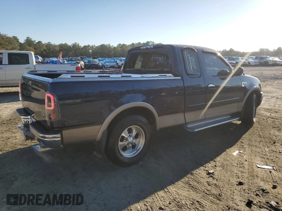 2002 Ford F-150 XL with VIN 1FTRX17L72NA39909, listed as a Copart auction lot 76376994 with 175,926 mi miles and Salvage title. Bid and sale history available at DreamBid. Image 3.