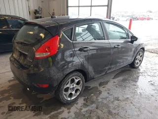 2011 Ford Fiesta SES with VIN 3FADP4FJ7BM196559, listed as a IAAI auction lot 41527976 with 65,861 mi miles. Bid and sale history available at carsss.com. Image 4.