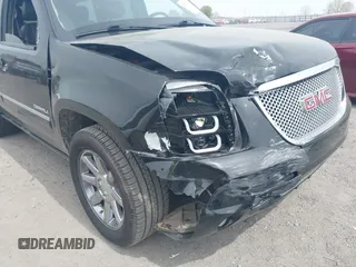 2014 GMC Yukon Denali z VIN 1GKS1EEFXER113493, wystawiony jako IAAI lot #41742662 z przebiegiem 150 382 mil mil oraz . Historia ofert i sprzedaży dostępna na DreamBid. Obrazek 6.