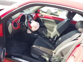 2012 Volkswagen Beetle 2.5L PZEV with VIN 3VWJP7AT5CM631505, listed as a IAAI auction lot 41733955 with 35,519 mi miles. Bid and sale history available at carsss.com. Image 5.