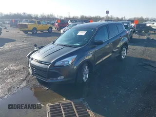 2016 Ford Escape SE with VIN 1FMCU9GX1GUB67636, listed as a IAAI auction lot 41929725 with 68,297 mi miles. Bid and sale history available at carsss.com. Image 2.