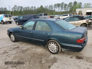 2000 Mercedes-Benz E-Class with VIN WDBJF65J1YB103093, listed as a Copart auction lot 51587325 with 208,350 mi miles and Salvage Title. Bid and sale history available at carsss.com. Image 2.