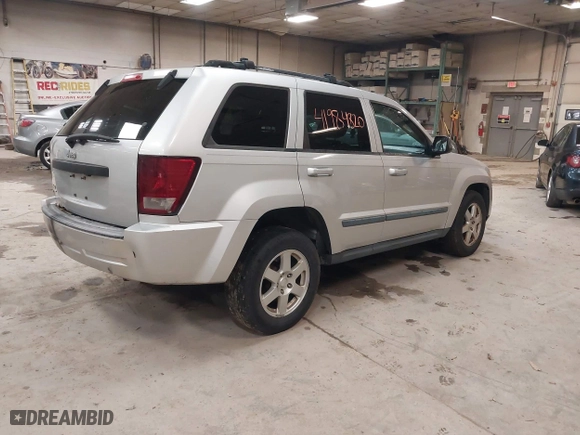 2009 Jeep Grand Cherokee Laredo with VIN 1J8GR48K89C553694, listed as a IAAI auction lot 41984820 with 196,266 mi miles. Bid and sale history available at carsss.com. Image 4.
