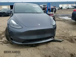 2023 Tesla Model Y Long Range z VIN 7SAYGDEE3PF884220, wystawiony jako Copart lot #52072605 z przebiegiem 44 996 mil mil oraz Czysty tytuł • Clean title. Historia ofert i sprzedaży dostępna na DreamBid. Obrazek 11.