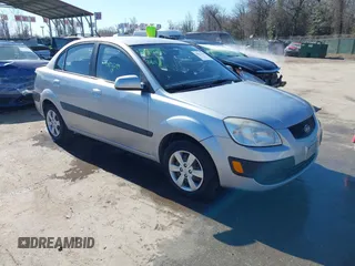 2009 Kia Rio LX with VIN KNADE223296495959, listed as a IAAI auction lot 41821299 with 116,626 mi miles and . Bid and sale history available at DreamBid. Image 1.