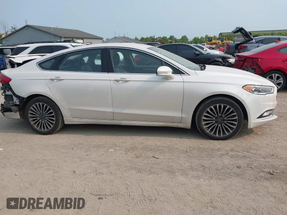 2017 Ford Fusion Titanium z VIN 3FA6P0K92HR396113, wystawiony jako IAAI lot #42402969 z przebiegiem 185 620 mil mil oraz . Historia ofert i sprzedaży dostępna na DreamBid. Obrazek 13.