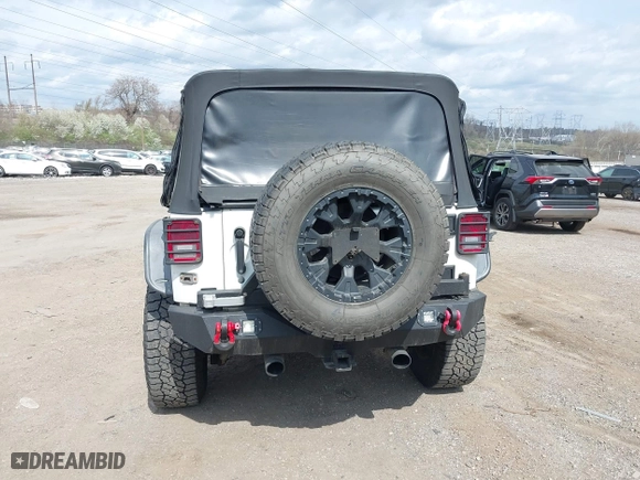 2012 Jeep Wrangler Unlimited Sahara with VIN 1C4BJWEG9CL220965, listed as a IAAI auction lot 41902295 with 120,492 mi miles. Bid and sale history available at carsss.com. Image 17.