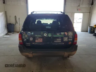 2004 Jeep Grand Cherokee Laredo z VIN 1J4GW48S14C338788, wystawiony jako Copart lot #53136715 z przebiegiem 150 352 mil mil oraz Szkoda całkowita • Salvage title. Historia ofert i sprzedaży dostępna na DreamBid. Obrazek 6.