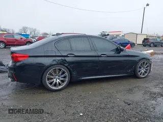 2018 BMW 5 Series M550i xDrive with VIN WBAJB9C59JB049114, listed as a IAAI auction lot 41543633 with 87,942 mi miles and . Bid and sale history available at carsss.com. Image 14.