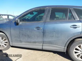 2016 Mazda CX-5 Sport with VIN JM3KE2BY3G0641895, listed as a IAAI auction lot 41689138 with 121,636 mi miles and . Bid and sale history available at DreamBid. Image 15.