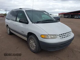 1999 Plymouth Voyager Grand SE z VIN 1P4GP44G5XB637050, wystawiony jako IAAI lot #41702235 z przebiegiem 335 309 mil mil oraz . Historia ofert i sprzedaży dostępna na DreamBid. Obrazek 1.