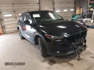 2019 Mazda CX-5 Touring with VIN JM3KFACM7K1568732, listed as a IAAI auction lot 41866736 with 50,753 mi miles. Bid and sale history available at carsss.com. Image 1.