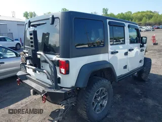 2014 Jeep Wrangler Unlimited Rubicon X with VIN 1C4BJWFG6EL240849, listed as a IAAI auction lot 42216082 with 118,912 mi miles and . Bid and sale history available at DreamBid. Image 4.