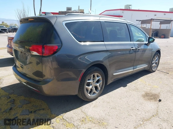 2017 Chrysler Pacifica Touring L with VIN 2C4RC1BG0HR826881, listed as a IAAI auction lot 42171240 with 214,188 mi miles and . Bid and sale history available at DreamBid. Image 4.