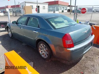 2006 Chrysler 300 C with VIN 2C3KA63H76H141246, listed as a IAAI auction lot 42035339 with 208,798 mi miles. Bid and sale history available at carsss.com. Image 3.