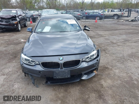 2015 BMW 4 Series 428i xDrive z VIN WBA4A7C5XFD415131, wystawiony jako IAAI lot #42100618 z przebiegiem 89 093 mil mil oraz . Historia ofert i sprzedaży dostępna na DreamBid. Obrazek 12.