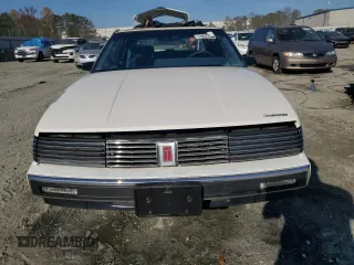 1987 Oldsmobile Toronado with VIN 1G3EZ1130HU307201, listed as a Copart auction lot 78028584 with 104,837 mi miles and Salvage Title. Bid and sale history available at DreamBid. Image 5.