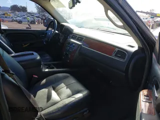 2014 Chevrolet Suburban LT with VIN 1GNSCJE08ER240230, listed as a IAAI auction lot 41702593 with 140,190 mi miles. Bid and sale history available at carsss.com. Image 5.