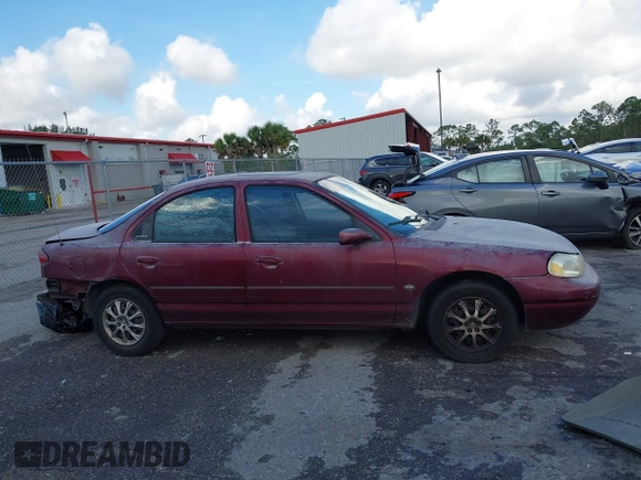 1999 Ford Contour SE z VIN 1FAFP6635XK169090, wystawiony jako IAAI lot #42198696 z przebiegiem 114 933 mil mil oraz . Historia ofert i sprzedaży dostępna na DreamBid. Obrazek 13.