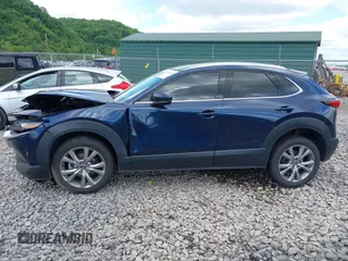 2021 Mazda CX-30 Premium z VIN 3MVDMBDL7MM236474, wystawiony jako IAAI lot #42284515 z przebiegiem 58 565 mil mil oraz . Historia ofert i sprzedaży dostępna na DreamBid. Obrazek 14.