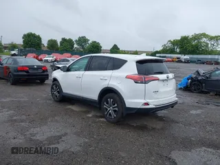 2018 Toyota RAV4 LE with VIN 2T3BFREV7JW851015, listed as a IAAI auction lot 42354042 with 94,603 mi miles and . Bid and sale history available at DreamBid. Image 3.