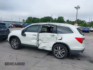 2016 Honda Pilot Elite with VIN 5FNYF6H00GB104329, listed as a IAAI auction lot 41905390 with 125,501 mi miles. Bid and sale history available at carsss.com. Image 14.