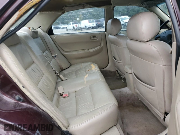 1998 Mazda 626 DX z VIN 1YVGF22CXW5775511, wystawiony jako Copart lot #78748784 z przebiegiem 158 570 mil mil oraz Szkoda całkowita • Salvage title. Historia ofert i sprzedaży dostępna na DreamBid. Obrazek 10.