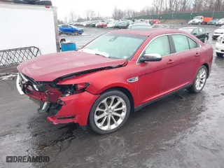 2015 Ford Taurus Limited with VIN 1FAHP2J89FG110114, listed as a IAAI auction lot 41568641 with 153,579 mi miles. Bid and sale history available at carsss.com. Image 2.