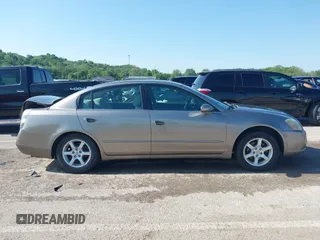 2005 Nissan Altima S z VIN 1N4AL11D05C281697, wystawiony jako IAAI lot #42220810 z przebiegiem 104 047 mil mil oraz . Historia ofert i sprzedaży dostępna na DreamBid. Obrazek 13.