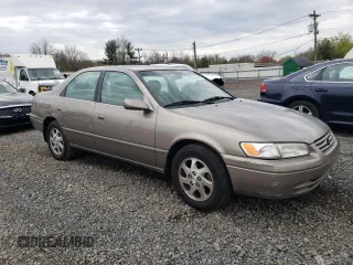 1999 Toyota Camry LE z VIN JT2BF28K6X0215555, wystawiony jako Copart lot #52587985 z przebiegiem 201 225 mil mil oraz Szkoda całkowita • Salvage title. Historia ofert i sprzedaży dostępna na DreamBid. Obrazek 4.