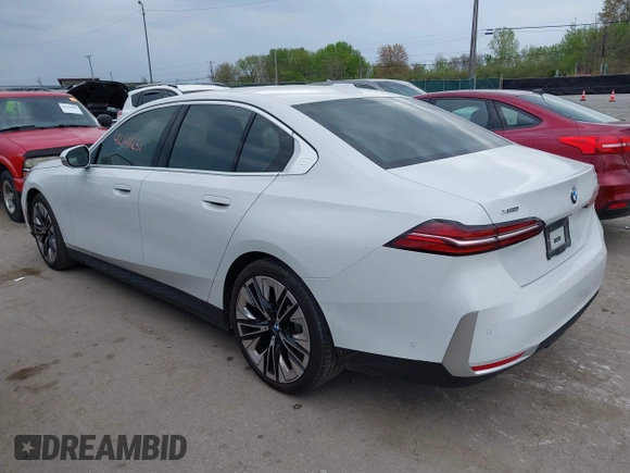 2024 BMW 5 Series 530i xDrive with VIN WBA53FJ03RCS25603, listed as a IAAI auction lot 42141231 with Not provided miles and . Bid and sale history available at DreamBid. Image 3.