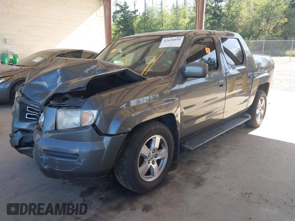 2007 Honda Ridgeline RTL with VIN 2HJYK16537H529904, listed as a IAAI auction lot 42626859 with 294,953 mi miles and . Bid and sale history available at DreamBid. Image 2.