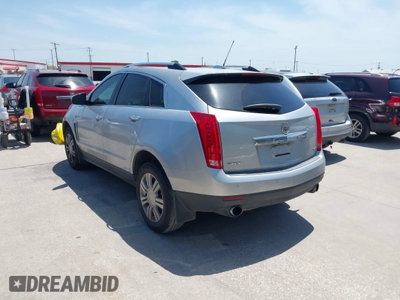 2015 Cadillac SRX Luxury Collection z VIN 3GYFNBE35FS627640, wystawiony jako IAAI lot #42262843 z przebiegiem 211 669 mil mil oraz . Historia ofert i sprzedaży dostępna na DreamBid. Obrazek 3.