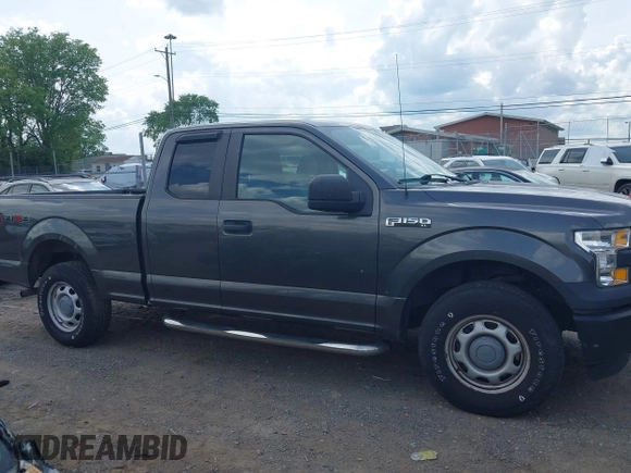 2015 Ford F-150 XLT with VIN 1FTEX1E89FKD84587, listed as a IAAI auction lot 42102545 with 141,265 mi miles. Bid and sale history available at carsss.com. Image 13.