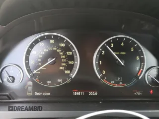 2012 BMW 7 Series 740Li with VIN WBAKB4C5XCC576227, listed as a Copart auction lot 52946135 with 154,611 mi miles and Salvage Title. Bid and sale history available at carsss.com. Image 9.