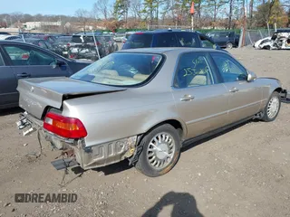 1995 Acura Legend L w/Cloth with VIN JH4KA7668SC012813, listed as a IAAI auction lot 41789026 with 242,265 mi miles. Bid and sale history available at carsss.com. Image 4.