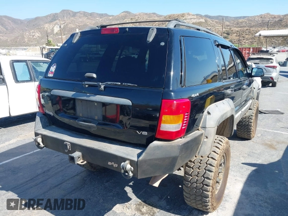 2000 Jeep Grand Cherokee Laredo with VIN 1J4GW48N0YC204645, listed as a IAAI auction lot 42650659 with 217,851 mi miles and . Bid and sale history available at DreamBid. Image 4.