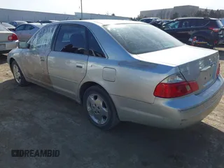 2003 Toyota Avalon XL z VIN 4T1BF28B43U323789, wystawiony jako IAAI lot #41416715 z przebiegiem 178 295 mil mil oraz . Historia ofert i sprzedaży dostępna na DreamBid. Obrazek 3.