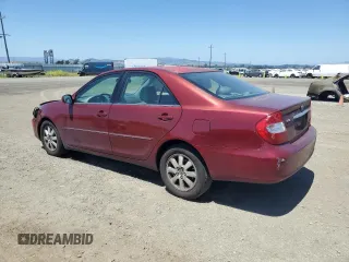 2003 Toyota Camry LE z VIN 4T1BF30K23U056007, wystawiony jako Copart lot #55187435 z przebiegiem 233 976 mil mil oraz Czysty tytuł • Clean title. Historia ofert i sprzedaży dostępna na DreamBid. Obrazek 2.