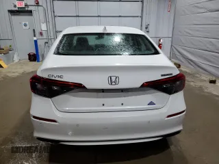 2022 Honda Civic Touring z VIN 2HGFE1F91NH313585, wystawiony jako Copart lot #56042115 z przebiegiem 30 954 mil mil oraz Szkoda całkowita • Salvage title. Historia ofert i sprzedaży dostępna na DreamBid. Obrazek 6.