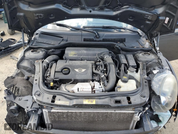 2015 MINI Coupe S z VIN WMWSX3C55FT409449, wystawiony jako Copart lot #66574174 z przebiegiem 99 155 mil mil oraz Szkody całkowita. Historia ofert i sprzedaży dostępna na DreamBid. Obrazek 11.