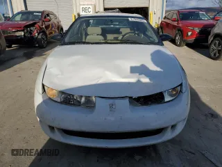 1999 Saturn SC with VIN 1G8ZR1275XZ375833, listed as a Copart auction lot 87960885 with 97,697 mi miles and Salvage Title. Bid and sale history available at carsss.com. Image 5.