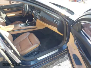 2011 BMW 7 Series 740i with VIN WBAKA4C52BC392112, listed as a IAAI auction lot 41736939 with 125,953 mi miles. Bid and sale history available at carsss.com. Image 5.