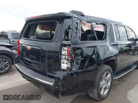 2019 Chevrolet Suburban Premier with VIN 1GNSKJKC7KR261826, listed as a IAAI auction lot 41652451 with 127,032 mi miles and . Bid and sale history available at DreamBid. Image 6.