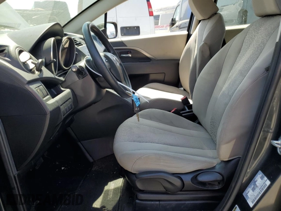 2012 Mazda 5 Sport with VIN JM1CW2BL0C0103969, listed as a Copart auction lot 64404424 with 133,398 mi miles and Salvage Title. Bid and sale history available at DreamBid. Image 7.